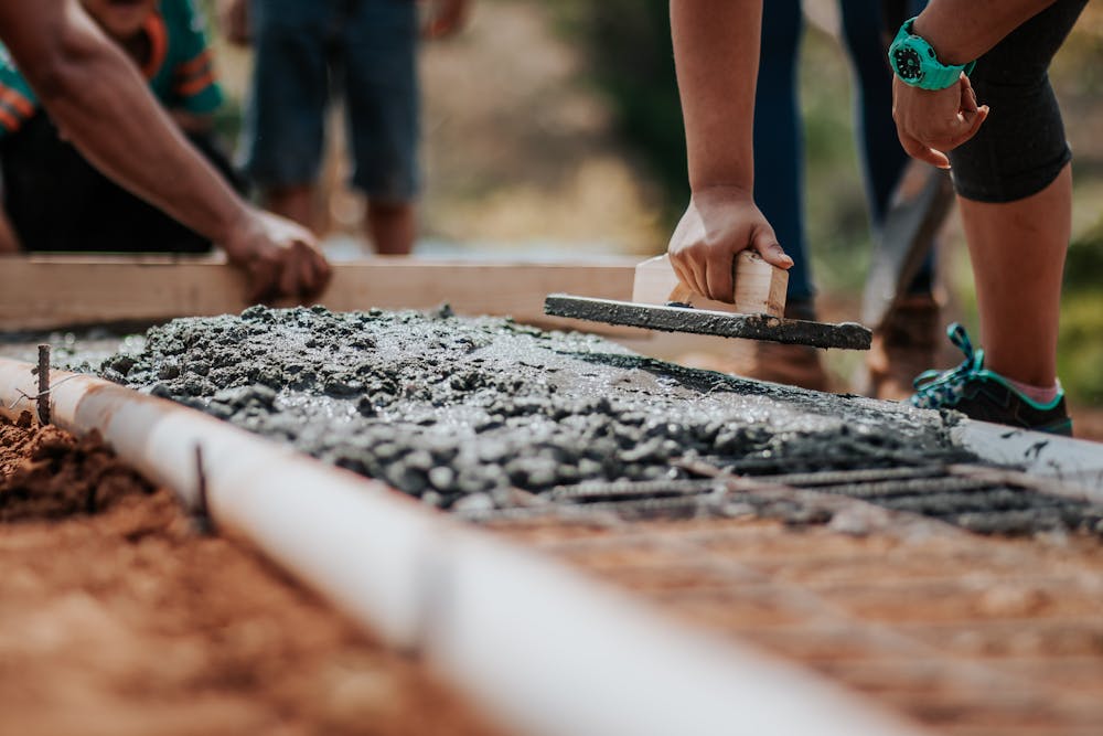 people working on a concrete structure